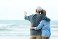 Asian Lifestyle senior couple hug on the beach happy in love romantic and relax time.ÃÂ  Tourism elderly family travel leisure and Royalty Free Stock Photo